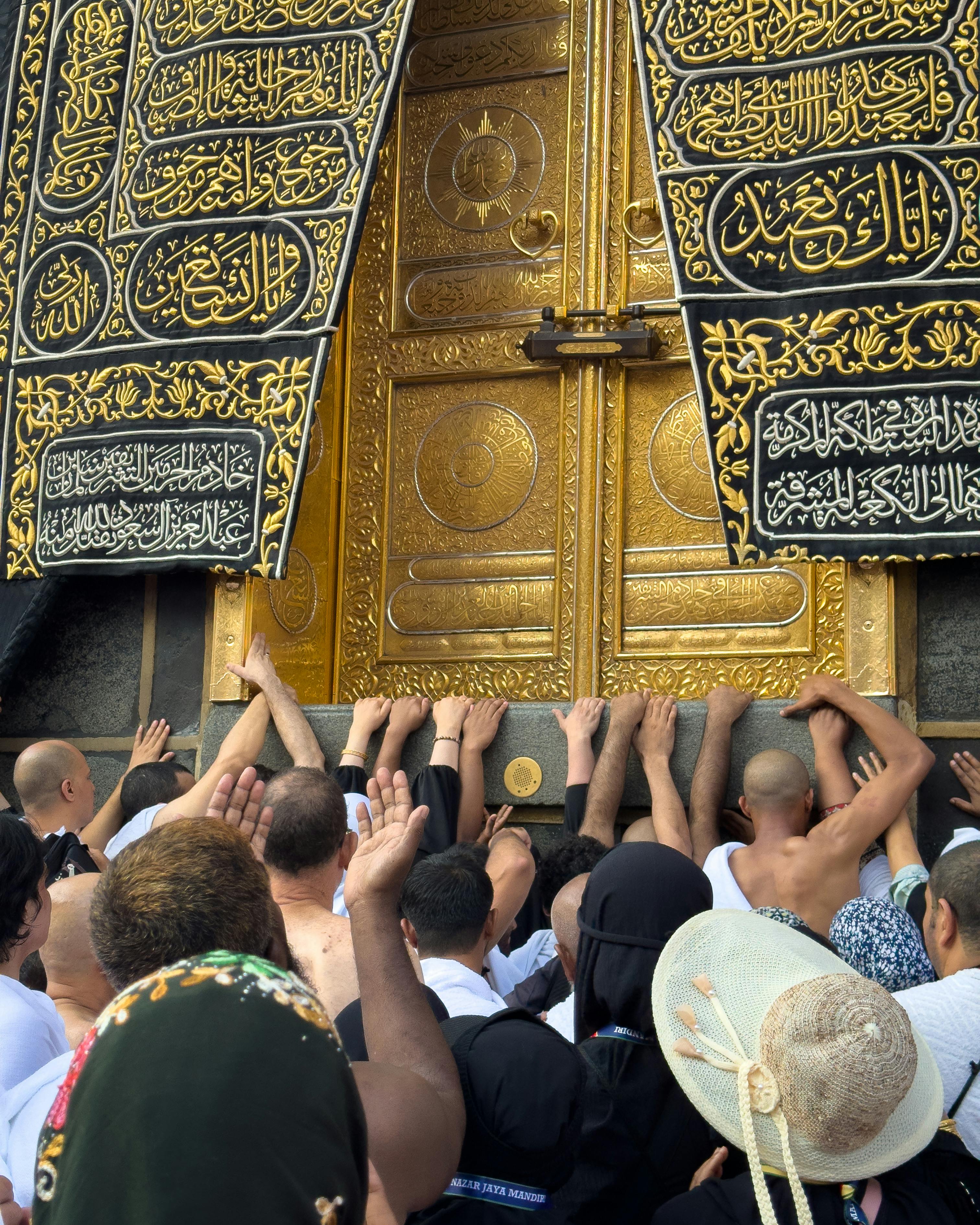 Pilgrims near the door of the Kaaba